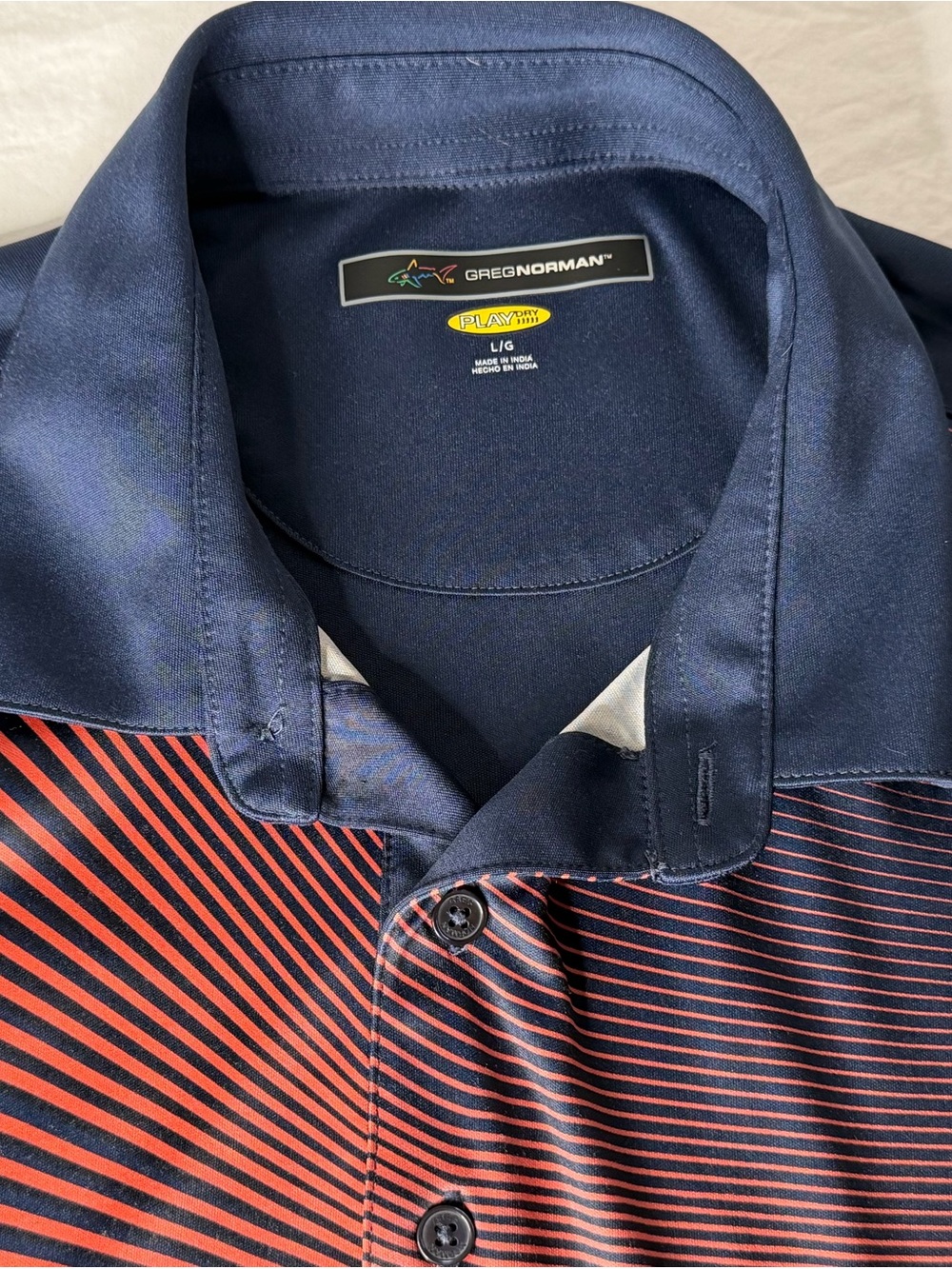 Greg Norman Collection Navy and Red Striped Polo